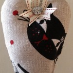 Black-Cat-hanging-heart-324x640