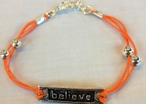 believe-bracelet-on-orange-cord